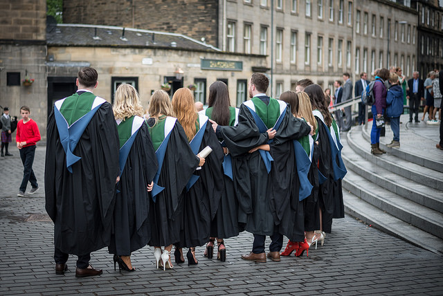 A row of ҹɫֱ graduands standing in a row wearing their gowns outside Usher Hall
